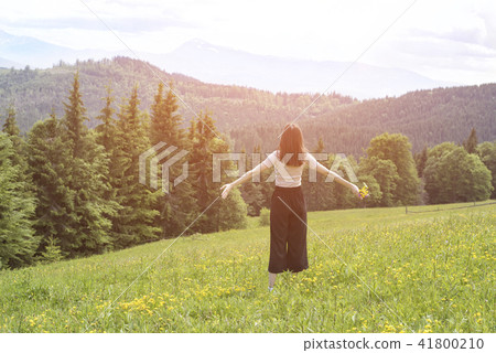 Young woman with a bouquet of flowers Young woman with a bouquet of flowers 41800210