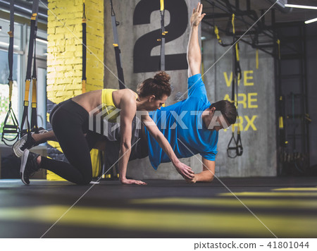 Calm athletes making physical exercise Calm athletes making physical exercise 41801044