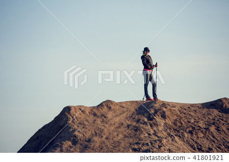 Full-length photo of girl growing tourist with backpack and walking sticks 41801921