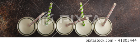 Milk (vegan nuts milk) in glass bottles 41803444