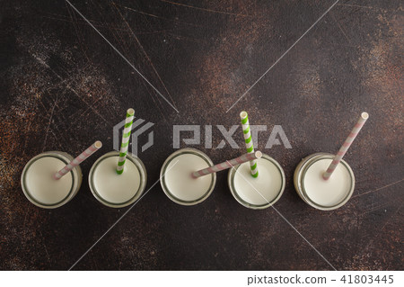 Milk (vegan nuts milk) in glass bottles Milk (vegan nuts milk) in glass bottles 41803445