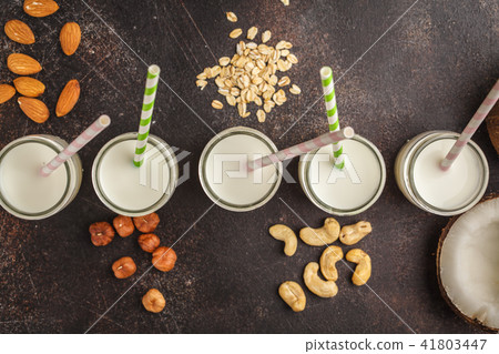 Vegan alternative nut milk in glass bottles  41803447