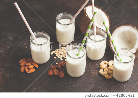 Vegan alternative nut milk in glass bottles  41803451