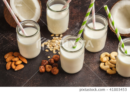 Vegan alternative nut milk in glass bottles  41803453