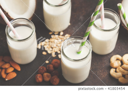 Vegan alternative nut milk in glass bottles  41803454