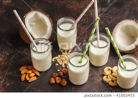 Vegan alternative nut milk in glass bottles  41803455
