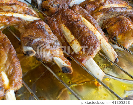 Detail of roast ribs on the grill Detail of roast ribs on the grill 41805238