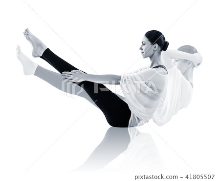 Young woman doing yoga exercise on the floor. Young woman doing yoga exercise on the floor. 41805507