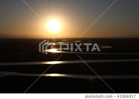 A river flowing through the Uyghur prairie A river flowing through the Uyghur prairie 41806917