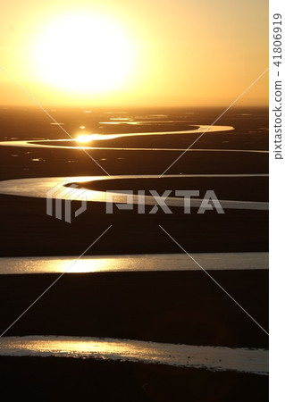 A river flowing through the Uyghur prairie A river flowing through the Uyghur prairie 41806919