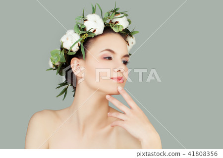 Spa Beauty. Cheerful Woman with Healthy Skin and White Cotton Fl Spa Beauty. Cheerful Woman with Healthy Skin and White Cotton Fl 41808356