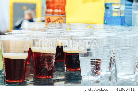 Water in plastic glasses Water in plastic glasses 41809411