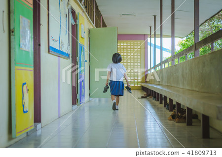 School girl walks to the classroom too late School girl walks to the classroom too late 41809713