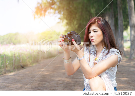 woman professional photographer with dslr camera. 41810027