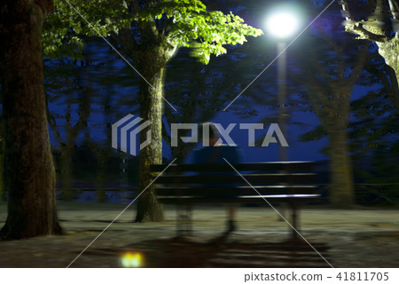 Male dark black silhouette on blurry night 41811705
