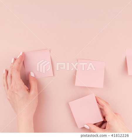 Woman hands with paper stickers Woman hands with paper stickers 41812226