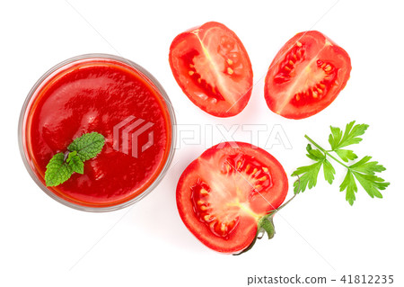 Tomato juice in glass and tomatoes with parsley leaves isolated on white background. Top view. Flat Tomato juice in glass and tomatoes with parsley leaves isolated on white background. Top view. Flat 41812235