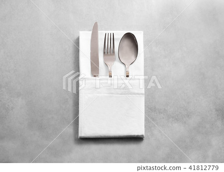 Blank white restaurant cloth napkin mockup with silver cutlery set Blank white restaurant cloth napkin mockup with silver cutlery set 41812779