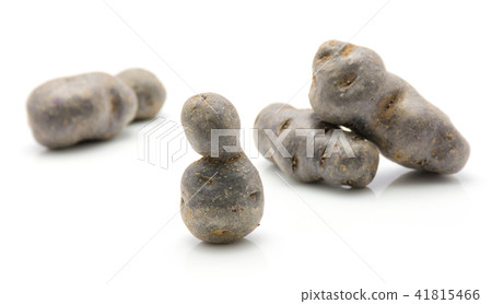 Fresh vitelotte potato isolated on white Fresh vitelotte potato isolated on white 41815466