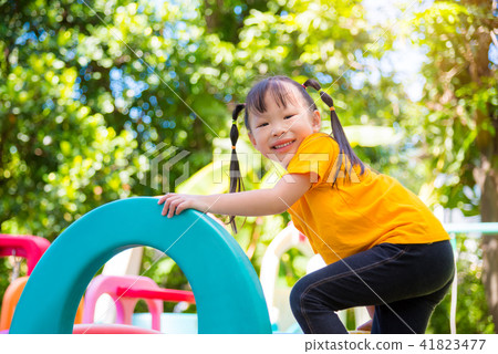 Little asian girl playing at school playground Little asian girl playing at school playground 41823477