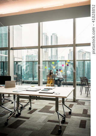 Modern empty office with transparent glass walls toward terrace Modern empty office with transparent glass walls toward terrace 41828852