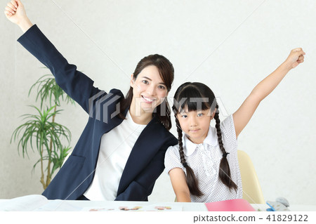 Teacher and student doing guts pose Teacher and student doing guts pose 41829122
