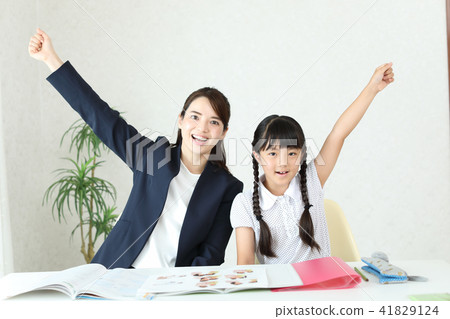 Teacher and student doing guts pose 41829124