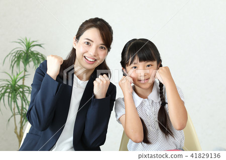 Teacher and student doing guts pose Teacher and student doing guts pose 41829136