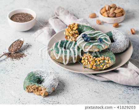 Vegan donuts topped spirulina glaze 41829203