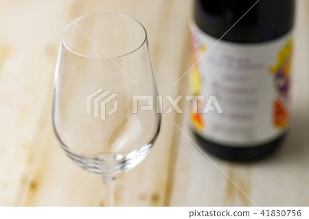 Wineglass and wine bottle 41830756