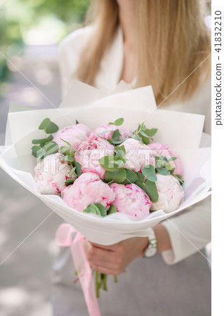 peonies. Young girl holding a flower. Beautiful summer bouquet. Arrangement with mix flowers peony peonies. Young girl holding a flower. Beautiful summer bouquet. Arrangement with mix flowers peony 41832210