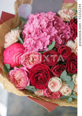 beautiful spring bouquet. flower arrangement with hydrangea and peonies. Color red and pink. The 41832244