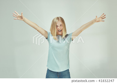 Winning success woman happy ecstatic celebrating being a winner. Dynamic energetic image of female Winning success woman happy ecstatic celebrating being a winner. Dynamic energetic image of female 41832247
