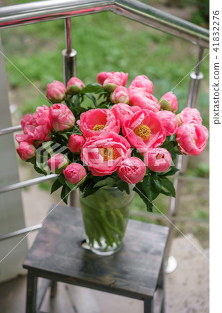 pink peonies. Beautiful summer bouquet. Floral composition. Wallpaper. Lovely flowers in glass vase. 41832276