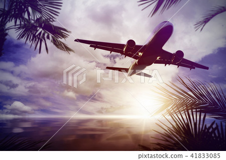 plane flying over tropical ocean 41833085