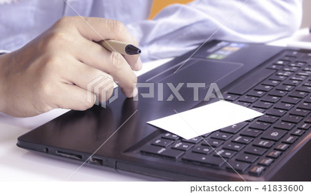 Hands using laptop and check business cards Hands using laptop and check business cards 41833600