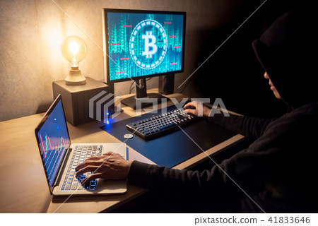 Man using computer for digital currency laundering 41833646