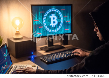 man using computer for digital currency laundering 41833660