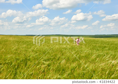 child is in the wheat field, bright sun, summer child is in the wheat field, bright sun, summer 41834422