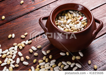 Dried beans on a wooden table 41835686