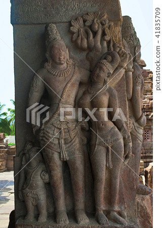 Carved figure of charming mithunas on the pillars Carved figure of charming mithunas on the pillars 41835709