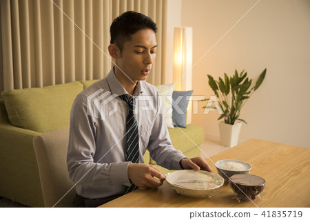Businessman / meal after late return home 41835719