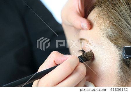 Makeup artist making makeup with makeup brush 41836182