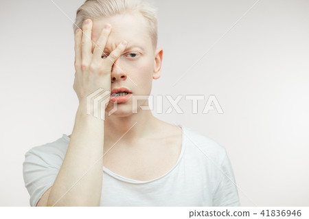 Blonde shocked man with wide opened mouth and bugged eyes shouting with horror. Blonde shocked man with wide opened mouth and bugged eyes shouting with horror. 41836946