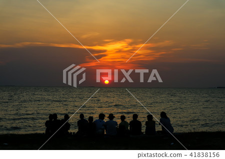 silhouette family look sunset sky on the beach 41838156