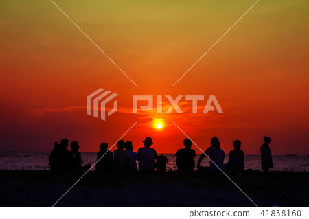 silhouette family meeting looking sunset on beach silhouette family meeting looking sunset on beach 41838160