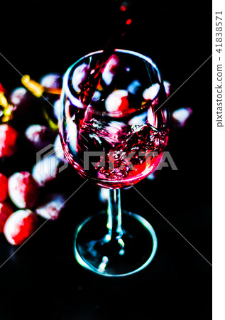 pouring red wine in a glass pouring red wine in a glass 41838571