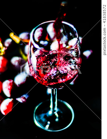 pouring red wine in a glass pouring red wine in a glass 41838572