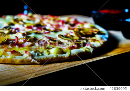 Delicious pizza with bacon, ham, mushrooms  41839095