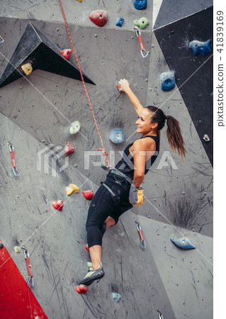 sporty woman in boulder climbing hall 41839169